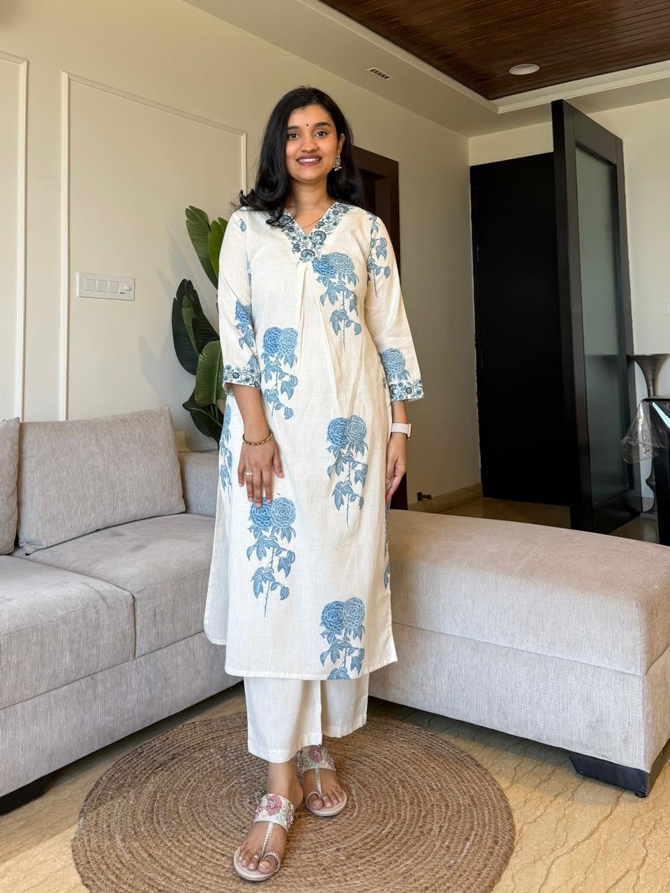 Graceful Cream Kurta Set with Indigo Blue Floral Print and Embroidered Neckline"