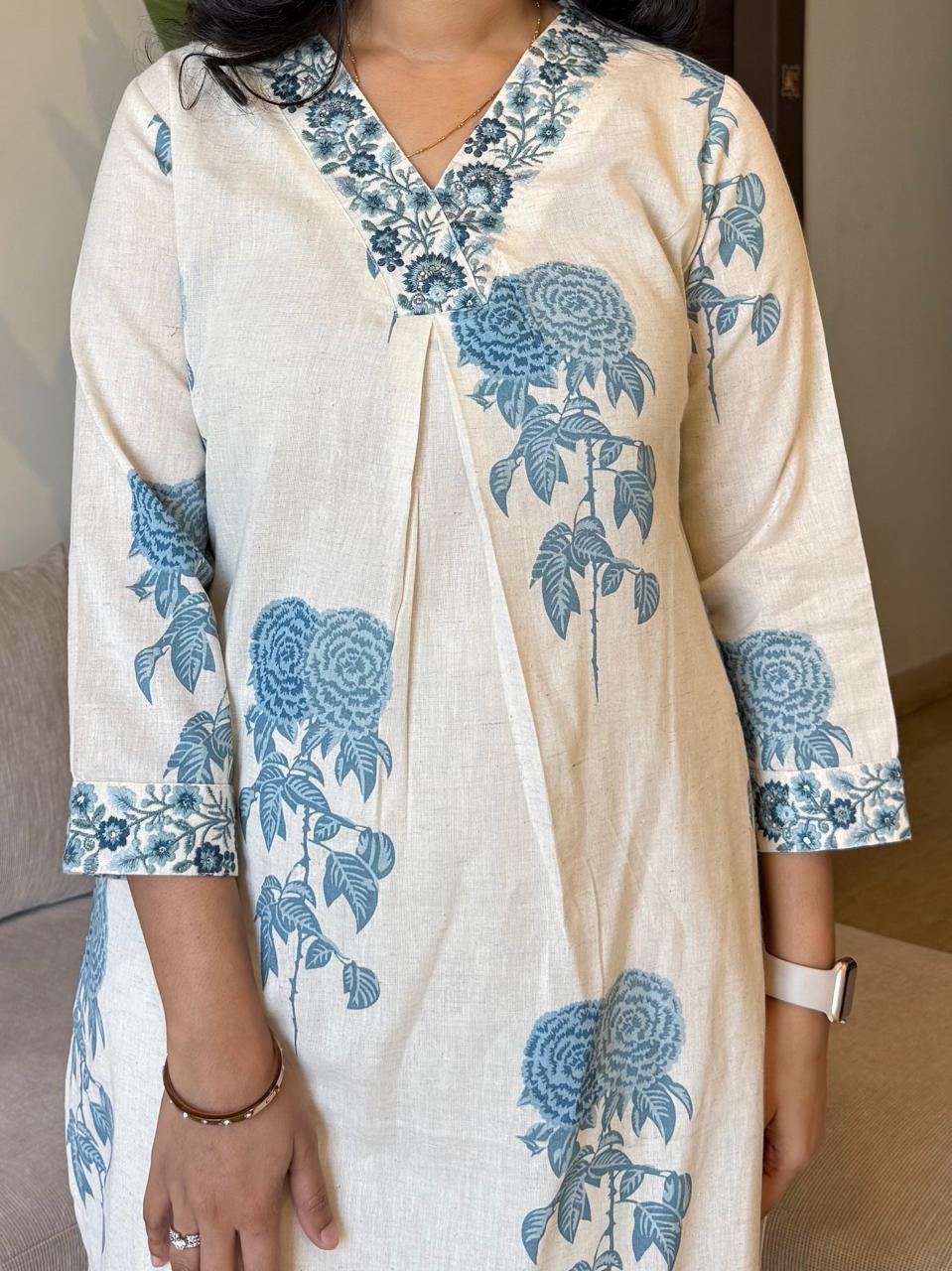 Graceful Cream Kurta Set with Indigo Blue Floral Print and Embroidered Neckline"