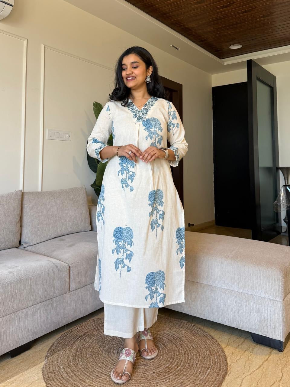 Graceful Cream Kurta Set with Indigo Blue Floral Print and Embroidered Neckline"