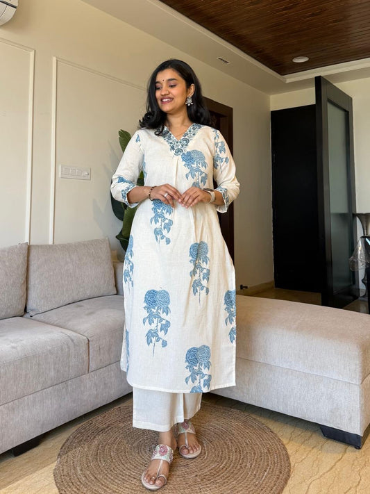 Graceful Cream Kurta Set with Indigo Blue Floral Print and Embroidered Neckline"